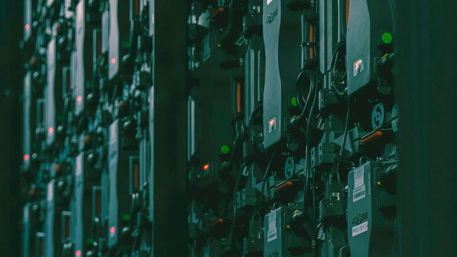 Equipment racks dense with labelled modules and part numbers